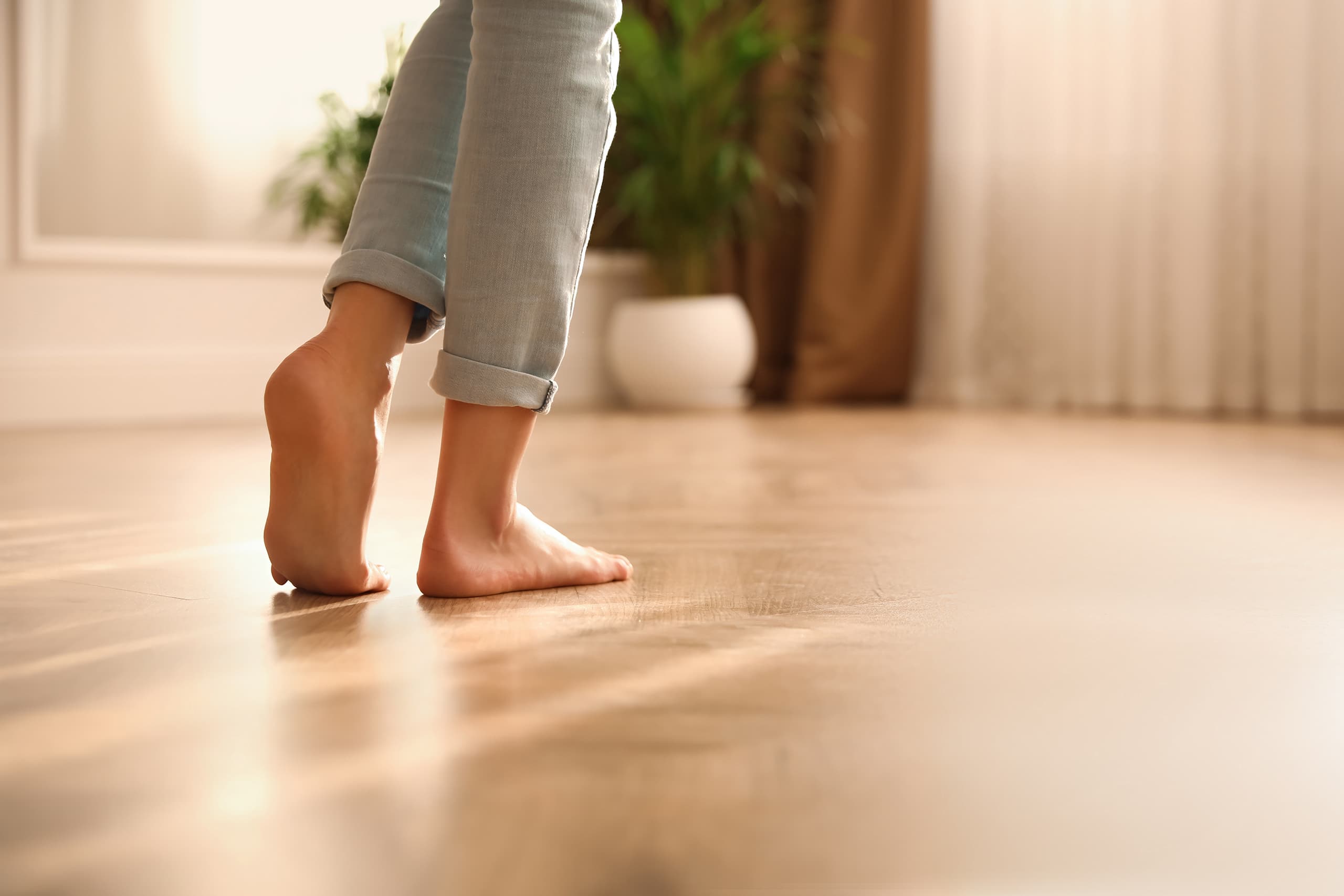 Barefoot,Woman,At,Home,,Closeup.,Floor,Heating,System